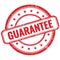 GUARANTEE text on red grungy round rubber stamp