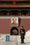 A guard standing in Tiananmen Square in front of the Gate of Heavenly Peace.