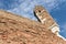 Guard tower on brick fortress over blue sky