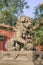 Guardian Lion in front of an ornamented pavilion at Yonghe Lamasery, also known as Lama Temple, Beijing, China