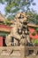 Guardian Lion in front of an ornamented pavilion at Yonghe Lamasery, also known as Lama Temple, Beijing, China