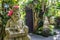 Guardian statue at the entrance with smoking incense, Bali Island, Indonesia