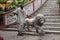 Guardian and a statue of a lion at the entrance to the Sree Sree Chanua Probhu Temple in Kolkata