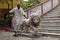 Guardian and a statue of a lion at the entrance to the Sree Sree Chanua Probhu Temple in Kolkata