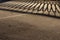 Guardrail Shadow on Icy Asphalt Road Surface