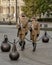 Guards marching in a circle around the flagpole near the Hungarian Parliament Building