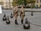 Guards marching in a circle around the flagpole near the Hungarian Parliament Building