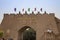 Guards in traditional uniforms on wall of Old City Kashgar, Xinjiang, China