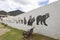 Guatavita endemic animals stained glass in a white wall in middle of town park