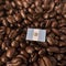 A Guatemala flag placed over roasted coffee beans
