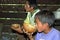 Guatemalan father and son drinking coconut milk