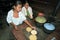 Guatemalan Indian teens preparing tortillas