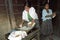 Guatemalan Indian teens preparing tortillas