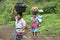 Guatemalan Indian women lugging laundry