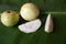 Guava fruit on a banana leaf. Fresh psidium guajava.