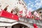 GUBBIO, ITALY - MAY 15 2016 - A colourful flag procession preceeds the arrival of the Ceri into the square to celebrate the annual