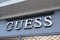 Guess usa brand logo and sign text on storefront shop luxury clothing American store line
