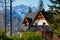 Guesthouse and mountain snowy landscape horizon