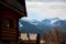 Guesthouse and mountain snowy landscape horizon