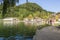 Guests and residents of Bled relax on the lake