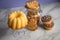 Gugelhupf ring cake, muffins, Italian puff pastry fan wavers cookies biscuits as selection buffet on marble table and lilac