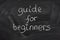 Guide for beginners title on a blackboard