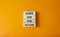 Guide for the future symbol. Wooden blocks with words Guide for the future. Beautiful orange background. Business and Guide for