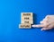 Guide for the future symbol. Wooden blocks with words Guide for the future. Businessman hand. Beautiful blue background. Business