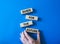 Guide for the future symbol. Wooden blocks with words Guide for the future. Businessman hand. Beautiful blue background. Business