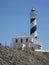 Guide lighthouse on top of a hill