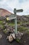Guidepost in colorful Landmanallaugar mountains, in the Fajllabak Nature Reserve in the Highlands of Iceland