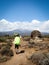 Guides porters and sherpas carry heavy sacks as they ascend mount kilimanjaro the tallest peak in africa.