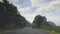 Guilin, China - February 28, 2020: First person of driving through rice fields and karst rocks in Guangxi province, China