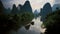 Guilins mountains are pulled up on the flat ground in a variety of ways, The water of Lijiang River is winding and clean as a