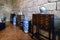 Guimaraes, Portugal. August 14, 2017: Display of desks with medieval drawers and china vases in a room of the palace of the Dukes