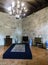 Guimaraes, Portugal. August 14, 2017: Display of desks with medieval drawers and china vases in a room of the palace of the Dukes