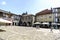 Guimaraes, Portugal. August 14, 2017: Downtown square of the village with cobblestone floor and stone facades of old houses with a