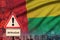 Guinea Bissau flag and Coronavirus 2019-nCoV alert sign. Concept of high probability of novel coronavirus outbreak through