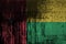 Guinea Bissau flag depicted in paint colors on old and dirty oil barrel wall closeup. Textured banner on rough background