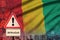 Guinea flag and Coronavirus 2019-nCoV alert sign. Concept of high probability of novel coronavirus outbreak through traveling