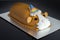 Guinea pig cake, soft madeira sponge layered with fruity raspberry jam and frosting finished with sweet edible decorations