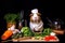 Guinea Pig Chef with Vegetables and Cooking Utensils