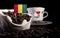 Guinean flag in a bag with coffee beans on black