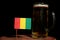 Guinean flag with beer mug on black