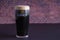 A Guinness dark Irish dry stout beer glass that originated