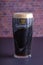 A Guinness dark Irish dry stout beer glass that originated in the brewery