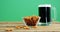 Guinness pint with bretzels ontable for st patricks
