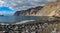 Guios beach with los gigantes cliffs and blurred tourists