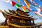 Guishan temple with giant buddhist tibetan prayer golden wheel in old town Shangri la