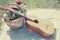 Guitar, basket with wine and bouquet of flowers